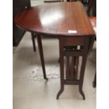 An Edwardian mahogany Sutherland table with oval top, on square splay legs