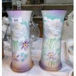 A pair of continental porcelain Art Nouveau vases of waisted cylindrical form, floral decoration