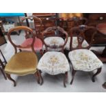 A set of three mahogany dining chairs, two carved balloon backs and another