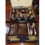 A gold plated canteen of cutlery in fitted case; 2 1930's marcasite brooches; a gilt compact with