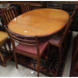A 1960's G-Plan teak extending dining table, and a set of 4 dining chairs; a pair of similar chairs