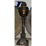 An early 20th century Corinthian column oil lamp in anodised metal, 24"