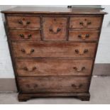 A 19th century oak 'Scotch' chest of 3 long, 4 short and 1 hat drawers, with swan neck handles, on