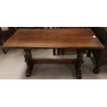 An oak Jacobean style coffee table with stretcher to base