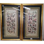 A pair of Chinese embroidered silk panels decorated with groups of figures, 57 cm x 24 cm, framed