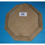 A Mouseman style oak octagonal cheeseboard, 20 cm