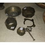 A Persian bras 'magic bowl', a brass lime pot, an Indian brass lidded pot and a brass African