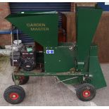 A large petrol driven "Garden Master" garden / branch shredder by Briggs and Strattan