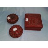 Two oriental red lacquered circular boxes and another square box