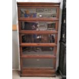 An early 20th century oak 5 height sectional bookcase by Globe Wernicke