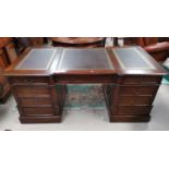 A large reproduction partner's desk with 12 drawers, two cupboards with brown leather effect inserts