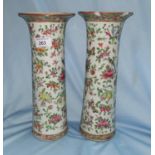 A pair of Chinese Canton porcelain vases decorated with flowers and fauna, 30 cm (1 a.f.)