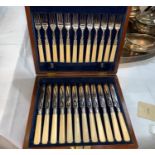 A set of 12 fish knives and forks in walnut case; a selection of mother-of-pearl handle tea