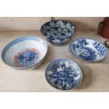 A Chinese blue and white bowl with mark to base, three similar Chinese bowls (some restoration to 2)