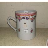 An 18th Century Chinese ceramic mug with hand painted decoration and relief design to handle