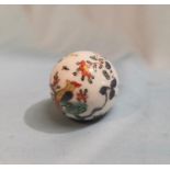 A Middle Eastern (possibly Turkish) hand painted porcelain ball 4.3cm diameter