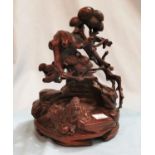 A Chinese bamboo stand extensively carved with reclining figure and overhanging banyan tree,