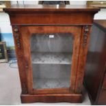 A Victorian walnut pier cabinet with single glazed door and gilt decoration