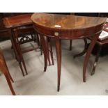 A nest of two inlaid mahogany tables and a reproduction mahogany demi lune table