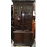 A 19th century mahogany full height corner cupboard, the upper section with moulded cornice, blind