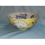 A Chinese porcelain bowl decorated with 3 urns alternating with circular panels on yellow textured