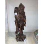 A Chinese root carving of a man with a stick height 33cm