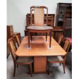 A mid 20th century teak G-Plan dining suite comprising of a canted rectangular table, 6 dining