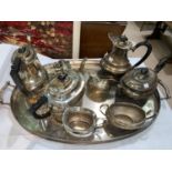 Two Georgian style EPNS tea services and a similar oval galleried tray