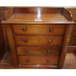 A Victorian collectors' mahogany miniature chest, with ledge back, 4 drawers, hinged locking to