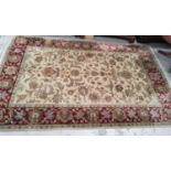 A large rust ground carpet 9'x 6'