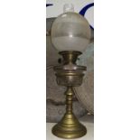 A 19th century brass oil lamp with cut glass reservoir, frosted shade and chimney, 22"