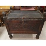 A 19th Century oak carved chest with floral pattern to front, split lid of small stature