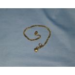 A yellow metal wrist chain, tests as 18 ct, 4.7 gm
