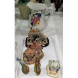 A Coalport cottage "The Old Curiosity Shop"; 2 composition figure groups; 2 porcelain birds; a large