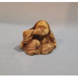 A late 19th / early 20th century Japanese carved Netsuke of a laughing female figure