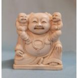 An early 20th century Chinese group depicting a Buddha with two ivory figures, height 7cm