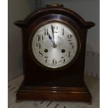 A 1920's Georgian style bracket clock with striking movement, brass ogee feet and handle
