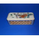 A Chinese porcelain box with pierced decoration to sides, hand painted scene to top and mark to