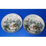 A p air of Chinese porcelain plates with polychrome decoration of mountain landscapes, marks to