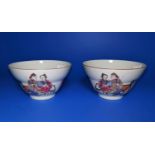 A pair of Chinese ceramic tea bowls with polychrome decoration and marks to base