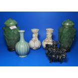 Two oriental lidded green stone ware vases ; a pair of stylised oriental vases and 2 other pieces