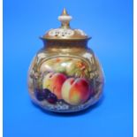 A Royal Worcester small squat covered vase with pierced lid, hand painted with fruit, signed '