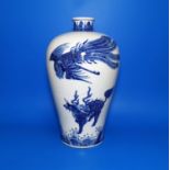 A large Chinese ceramic blue and white plum shape vase decorated with Phoenix and other mystical