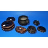 A Chinese bronze censer and a selection of hardwood stands