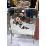 An Art Nouveau painted mirror firescreen in brass frame; a modern footstool in gold