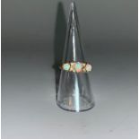A Victorian style 9 carat hallmarked gold ring set 3 opal coloured stones and 4 small diamonds, 2.
