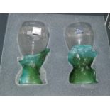 A pair of modernist wine glasses with naturalistic green bases by Daum, in original box