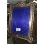 A silver large gadrooned photo frame, Chester 1902, height 11"