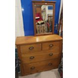 A pine dressing chest with mirror over 2 long and 2 short drawers