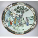 A 19th century Chinese Cantonese shallow dish decorated in polychrome with figures by a tree, 4